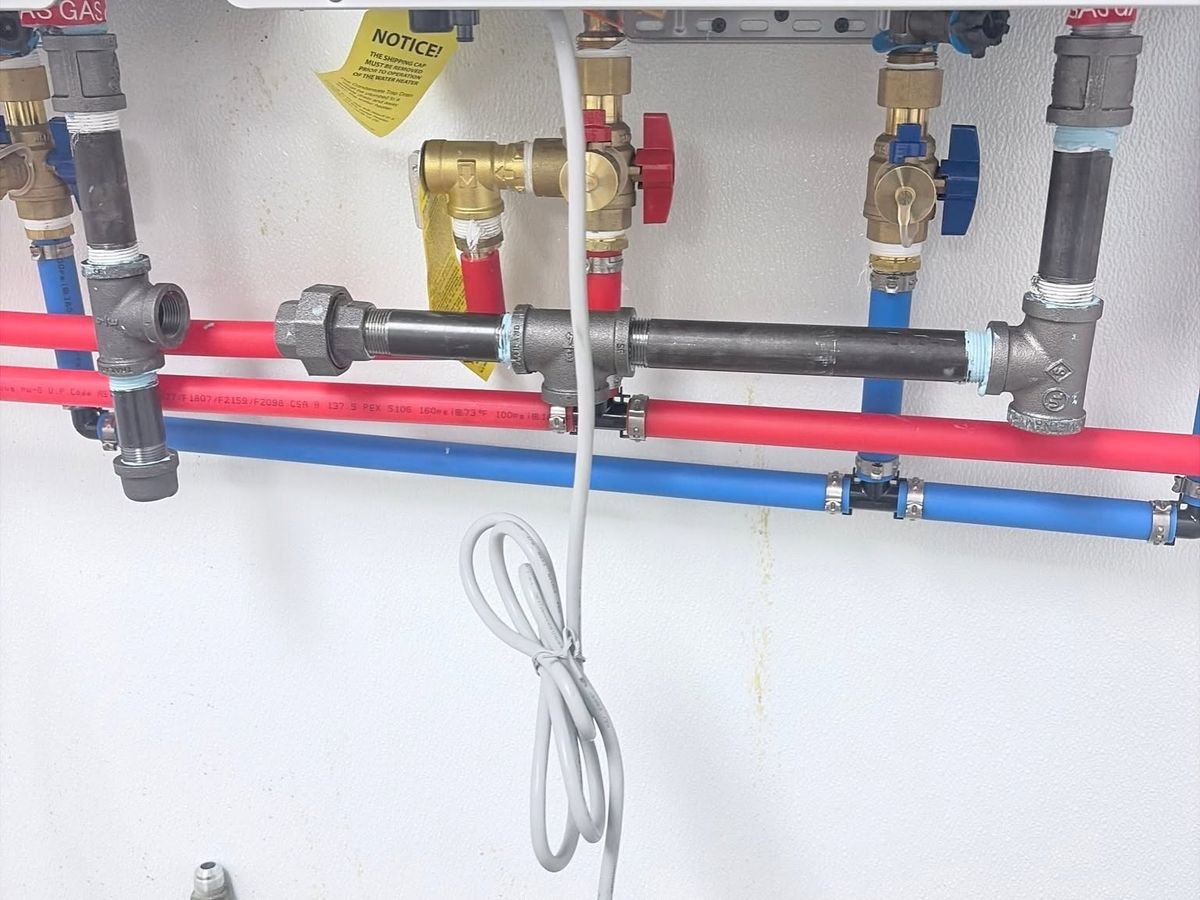 Red and blue PEX and black iron gas piping
