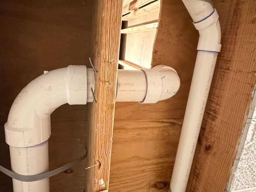 PVC drain pipes with elbows strapped