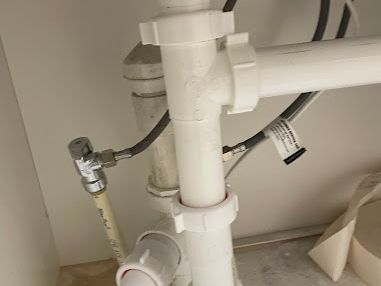 Vertical white PVC drain stack