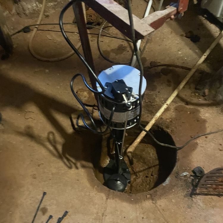 Sump pump in a basement floor pit